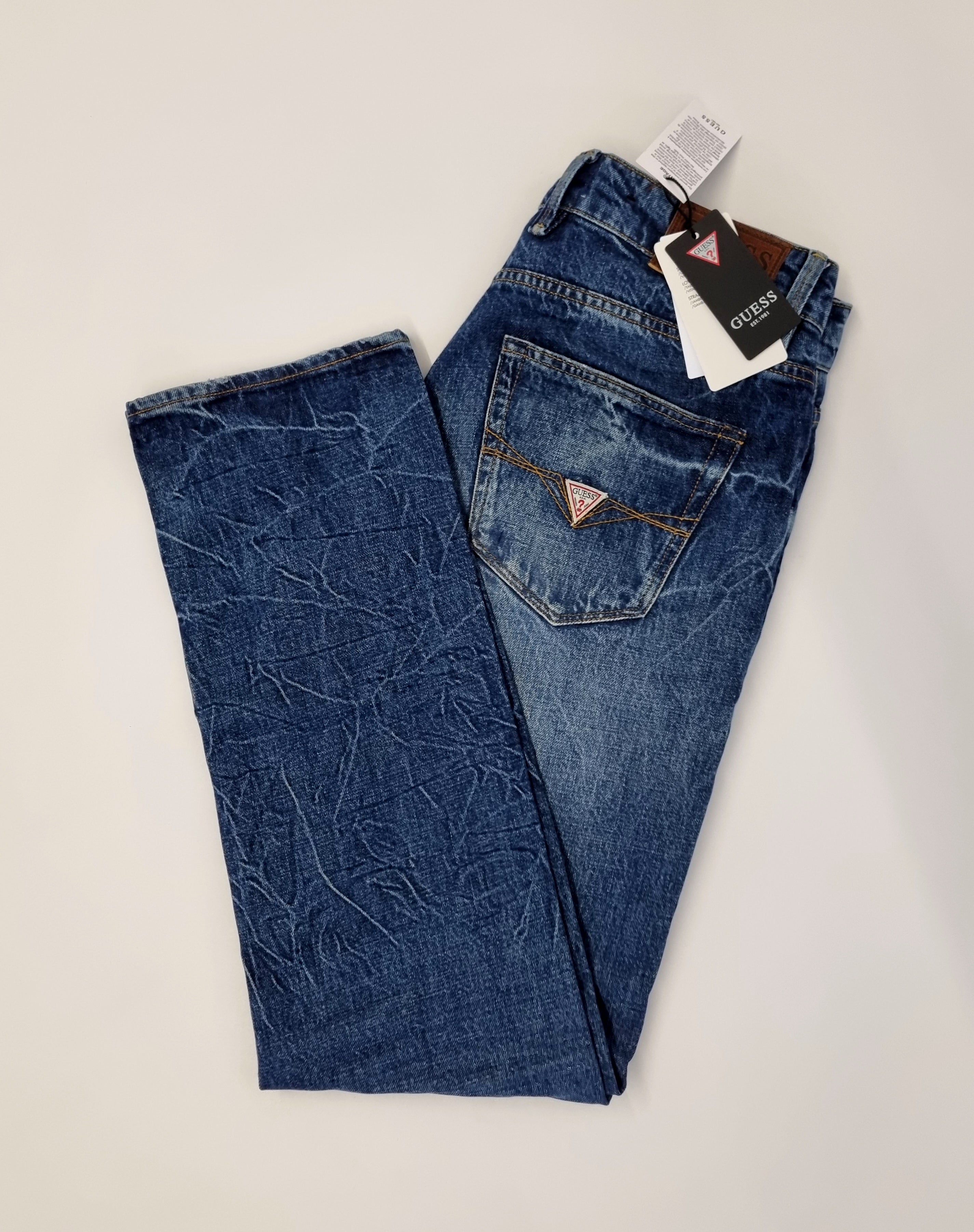 Mix of jeans and trousers by Guess